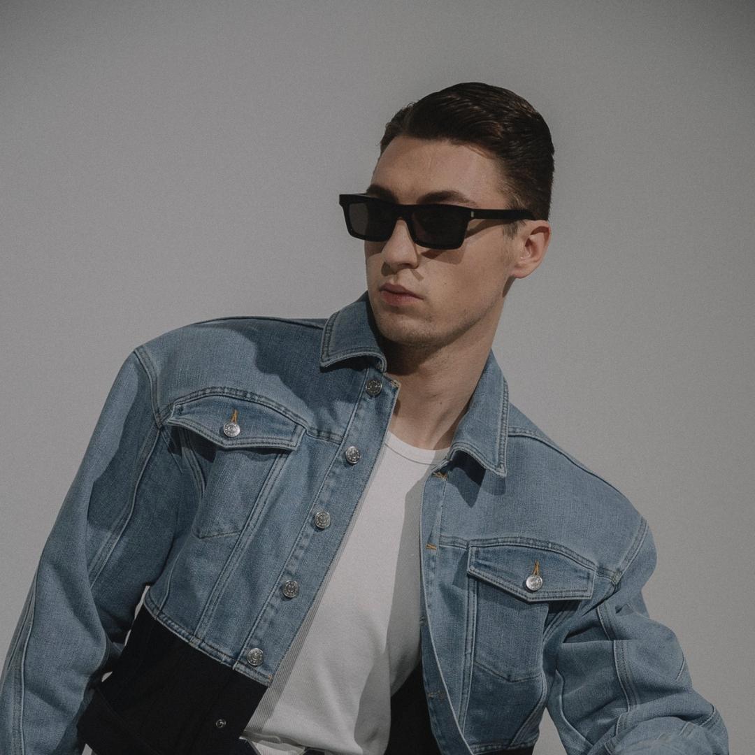 Denim layers and sculptural black sunglasses in the MG campaign